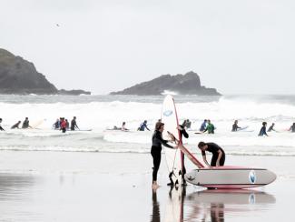 People on the beach and in the surf